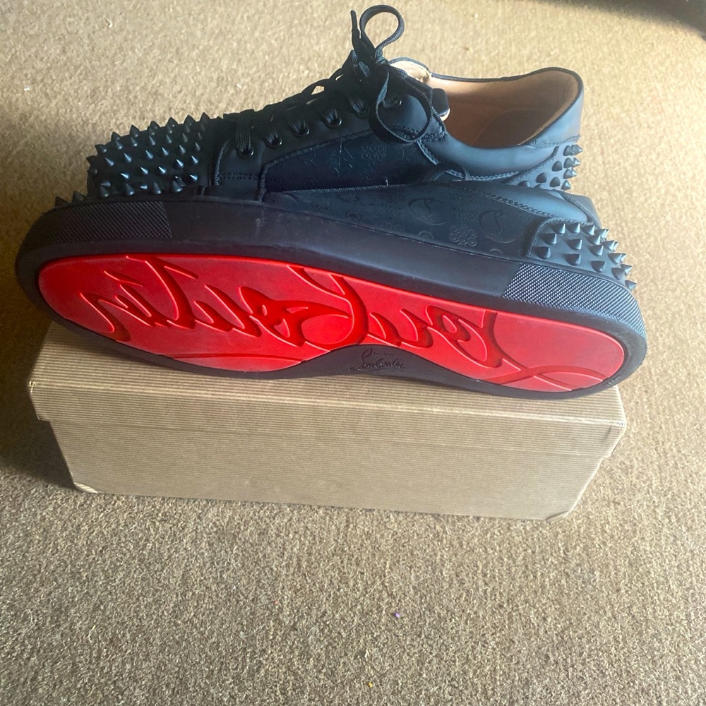 Christian Louboutin “Black Monogram” Red bottoms